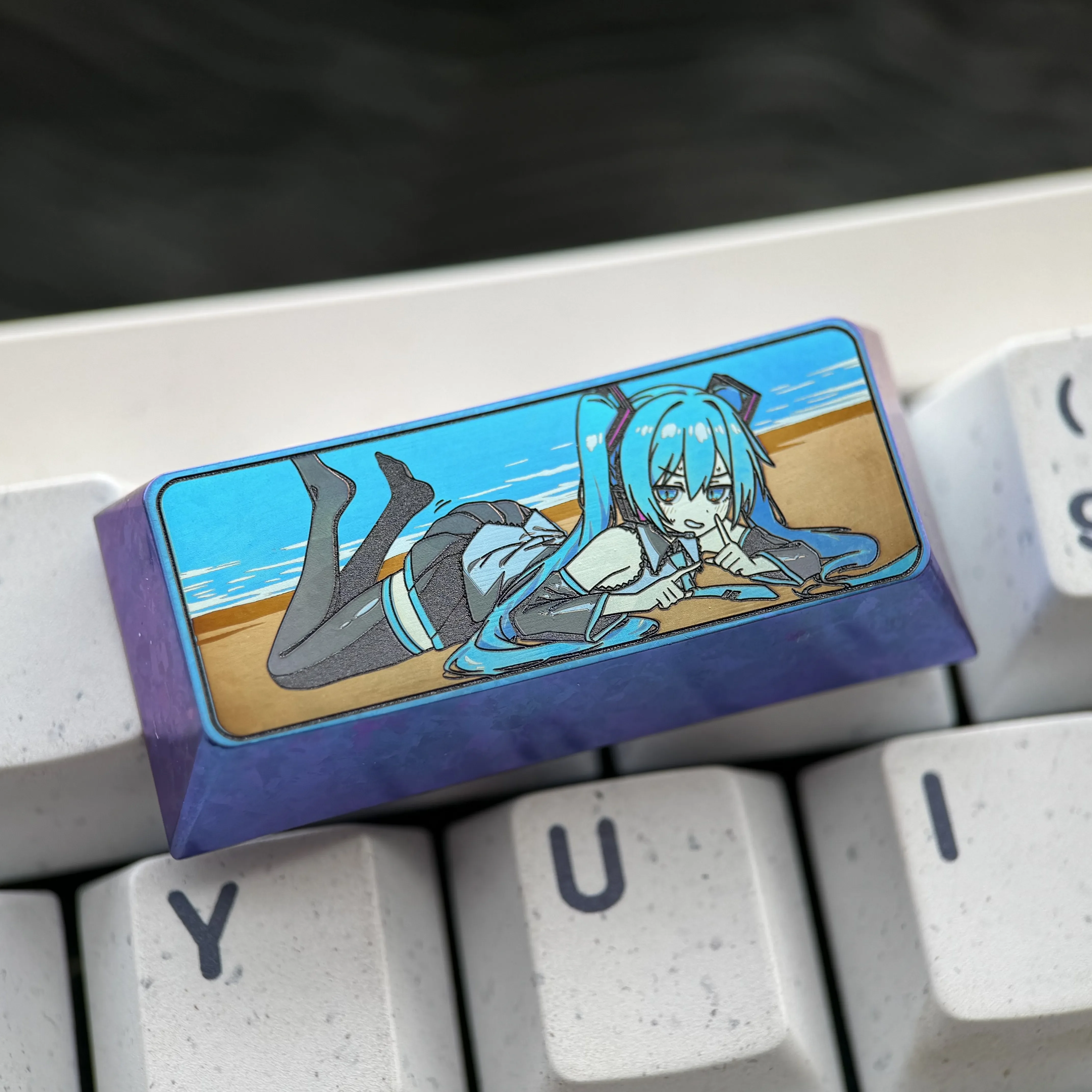 Exclusive Hatsune Miku Titanium Keycap with vibrant, metallic artistry showcasing premium craftsmanship for custom mechanical keyboards.