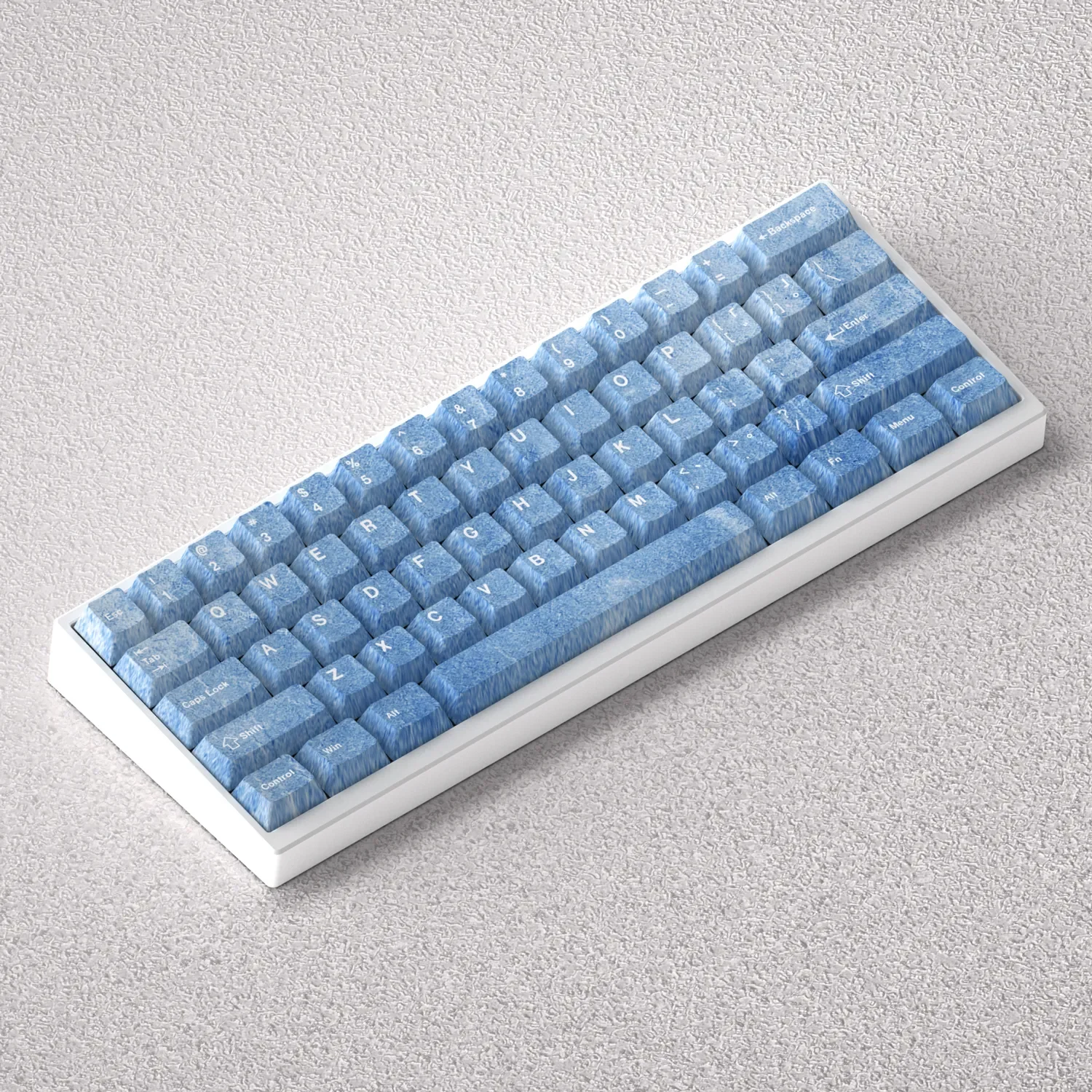 Multiple angles of premium Haze Blue PBT keycap set, highlighting their serene color, durable texture, and comfortable Cherry profile for a modern deisgn.