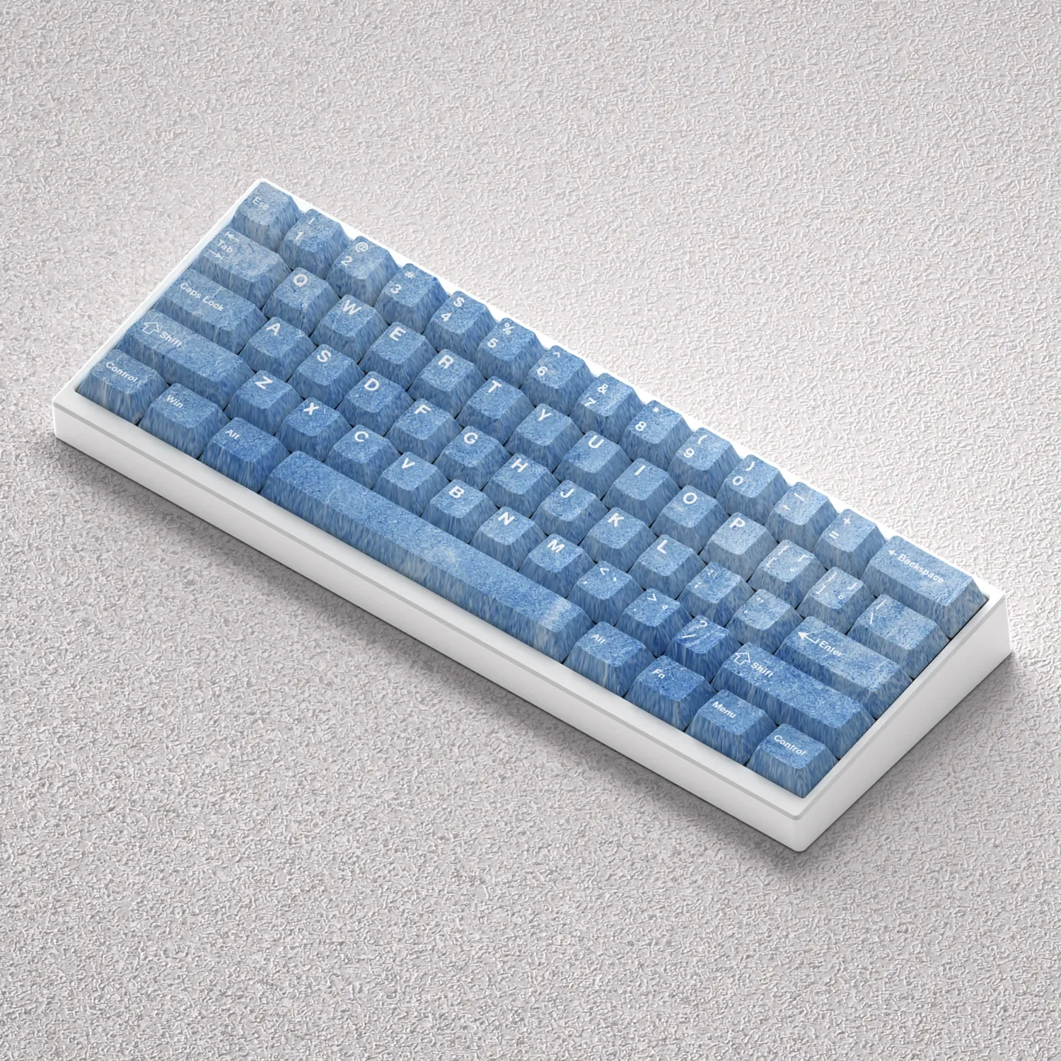 A serene collection of Haze Blue PBT keycaps set in Cherry profile, showcasing their opaque, minimalist design from various angles for a premium keyboard.