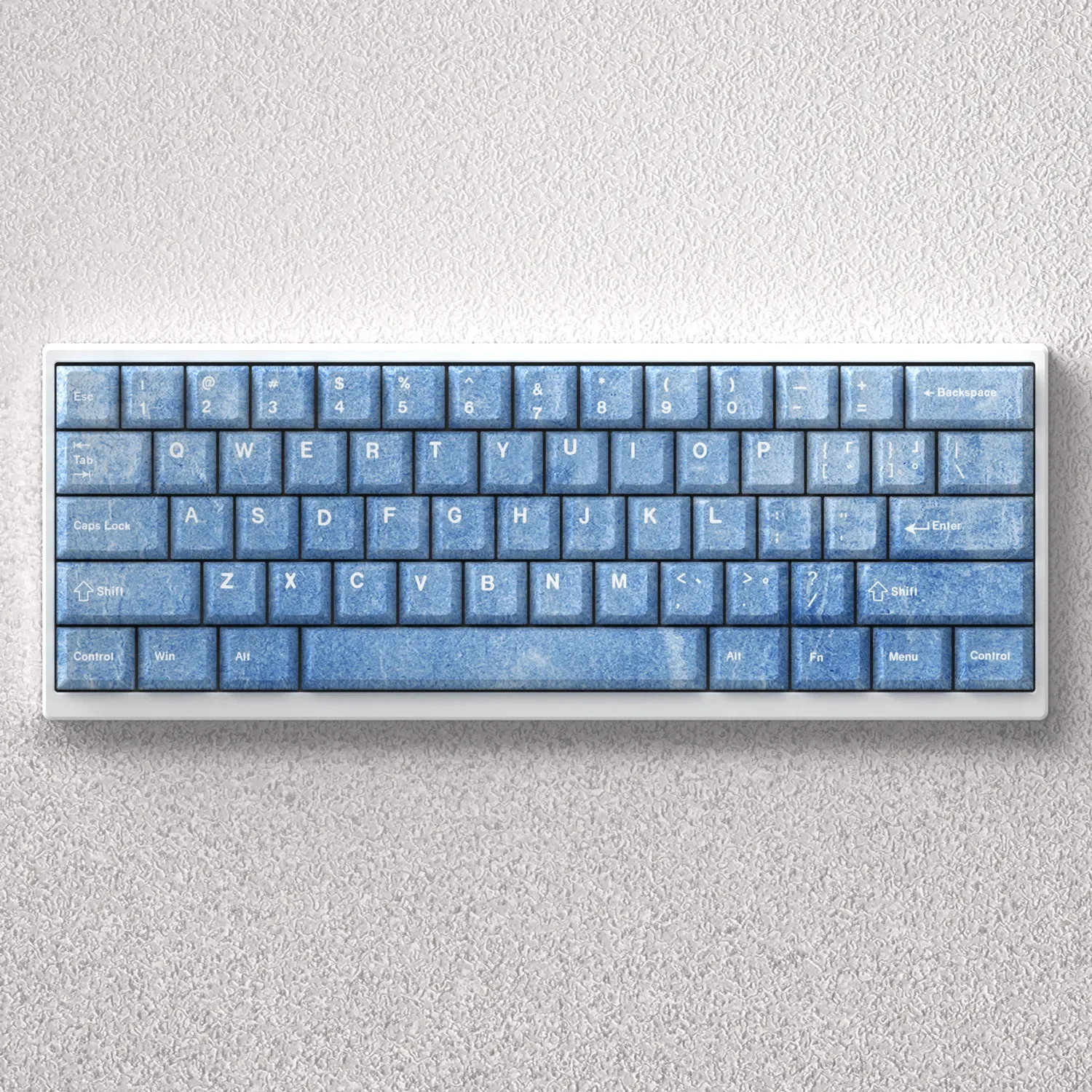 Premium Haze Blue PBT keycap set in Cherry profile, showcasing their serene, minimalist aesthetic and smooth texture on a modern keyboard setup.
