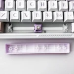 Playful Translucent Heart Space Key Keycap, showcasing its double-shot ABS illuminated heart motif from various angles, a modern keyboard accent.