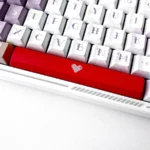 Playful Translucent Heart Space Key Keycap, a 6.25u double-shot ABS spacebar, shown from various angles highlighting its illuminated modern aesthetic.