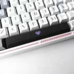 Vibrant Translucent Heart Space Key Keycap, captured from a unique angle, highlighting its playful illuminated double-shot ABS design.