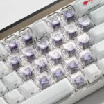 Sleek transparent luminous heart keycaps set for magnetic keyboards, subtly glowing with custom RGB, a premium aesthetic upgrade.