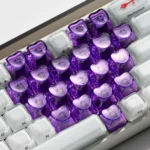 Sleek, transparent luminous heart keycaps set for magnetic keyboards, showcasing a subtle RGB glow and premium design.