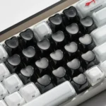 Premium transparent black luminous heart keycaps set for magnetic keyboards, showcasing their unique OEM profile and subtle RGB glow.