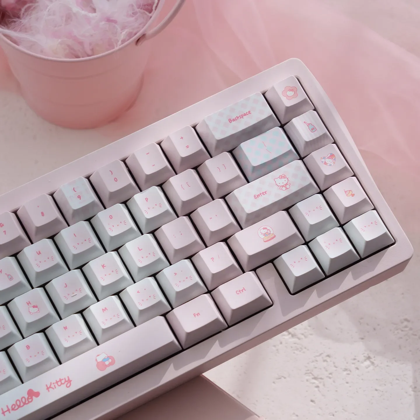 Hello Kitty PBT dye-sub keycaps set. Multiple views of the playful pink set, highlighting durable quality and iconic Hello Kitty characters.