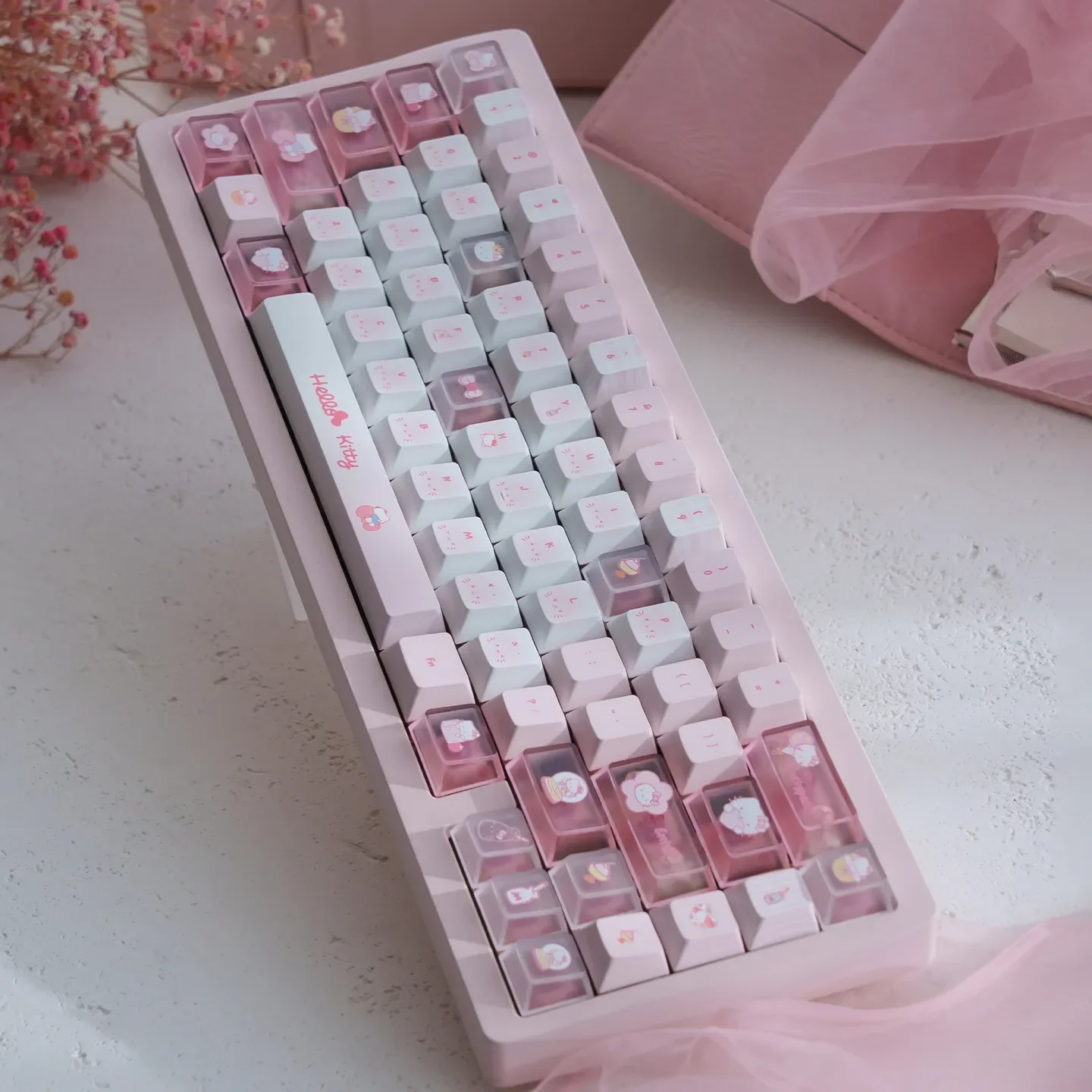 Vibrant Hello Kitty PBT dye-sub keycaps set, featuring playful pink designs for a charming mechanical keyboard aesthetic.