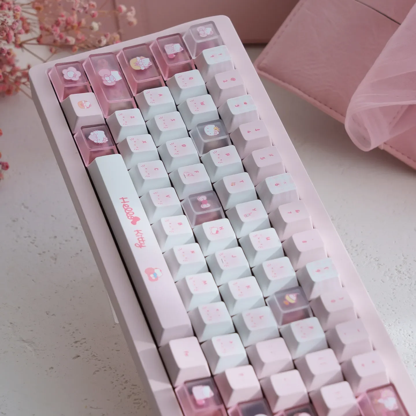 Hello Kitty PBT dye-sub keycaps set in playful pink, showcasing various iconic characters and durable PBT texture from different angles.