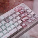Hello Kitty PBT dye-sub keycaps set. Playful pink Cherry profile Hello Kitty keycaps in a vibrant gallery, showing angles for mechanical keyboards.