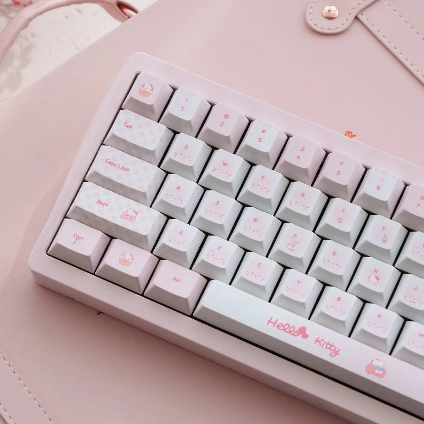 Vibrant Hello Kitty PBT dye-sub keycap set displayed from multiple angles, highlighting durable quality and charming pink design.