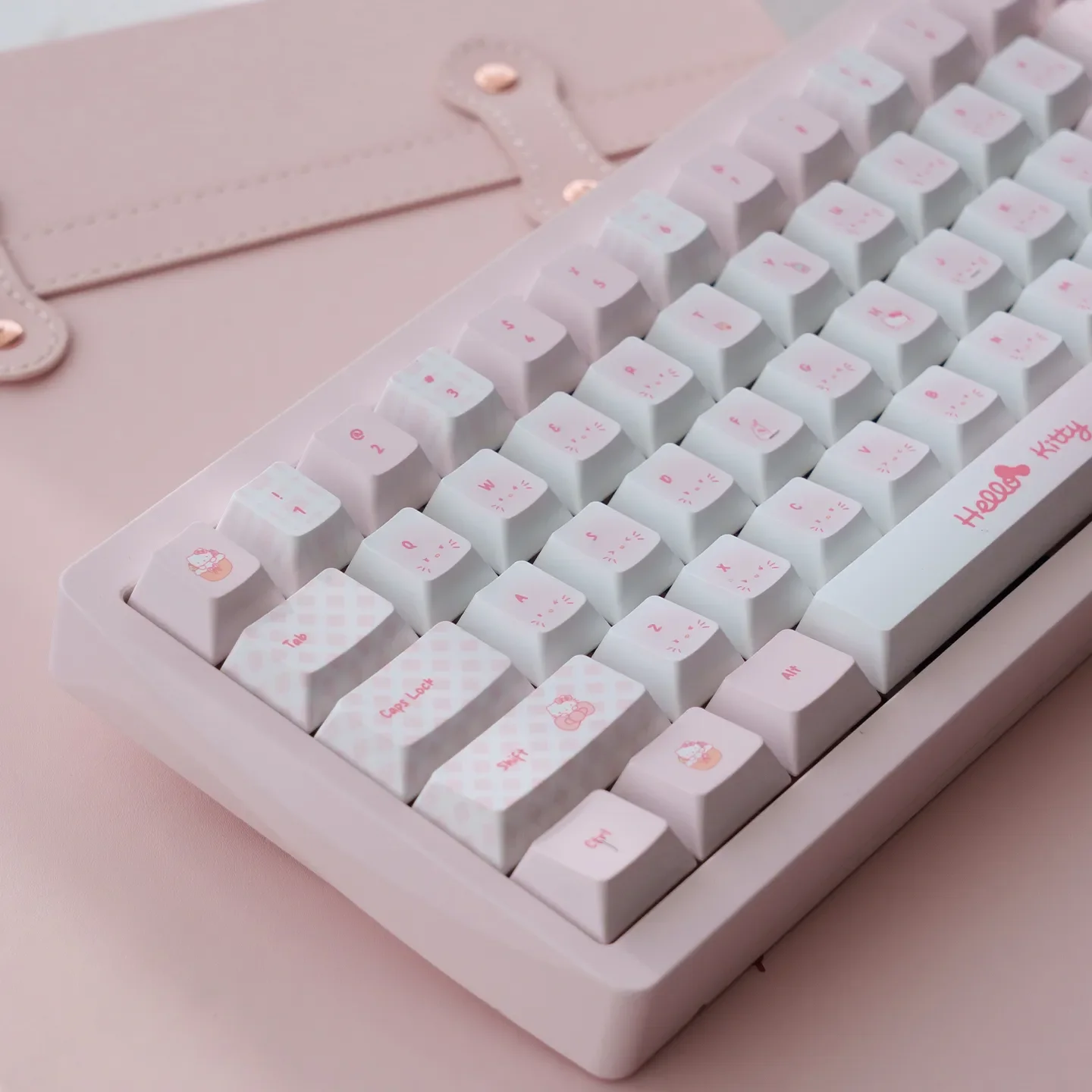 Playful Hello Kitty PBT dye-sub keycaps set in charming pink, showcasing the full Cherry profile set from multiple angles, highlighting iconic characters.