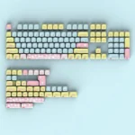 Adorable Hello Kitty MOA profile keycaps set arranged playfully on a keyboard, featuring pastel colors and cheerful character designs for a cute design.