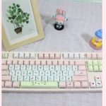 Exclusive Hello Kitty pink PBT keycaps set artfully arranged, showcasing charming character designs perfect for a whimsical keyboard aesthetic.