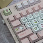 Showcasing the exclusive Hello Kitty Keycaps set in vibrant pink PBT, featuring whimsical spherical keycaps for a charming, playful keyboard.