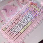 Joyful Hello Kitty dye-sub PBT keycaps set, viewed from a delightful angle, highlighting the iconic pastel pink and white characters and crisp legends.
