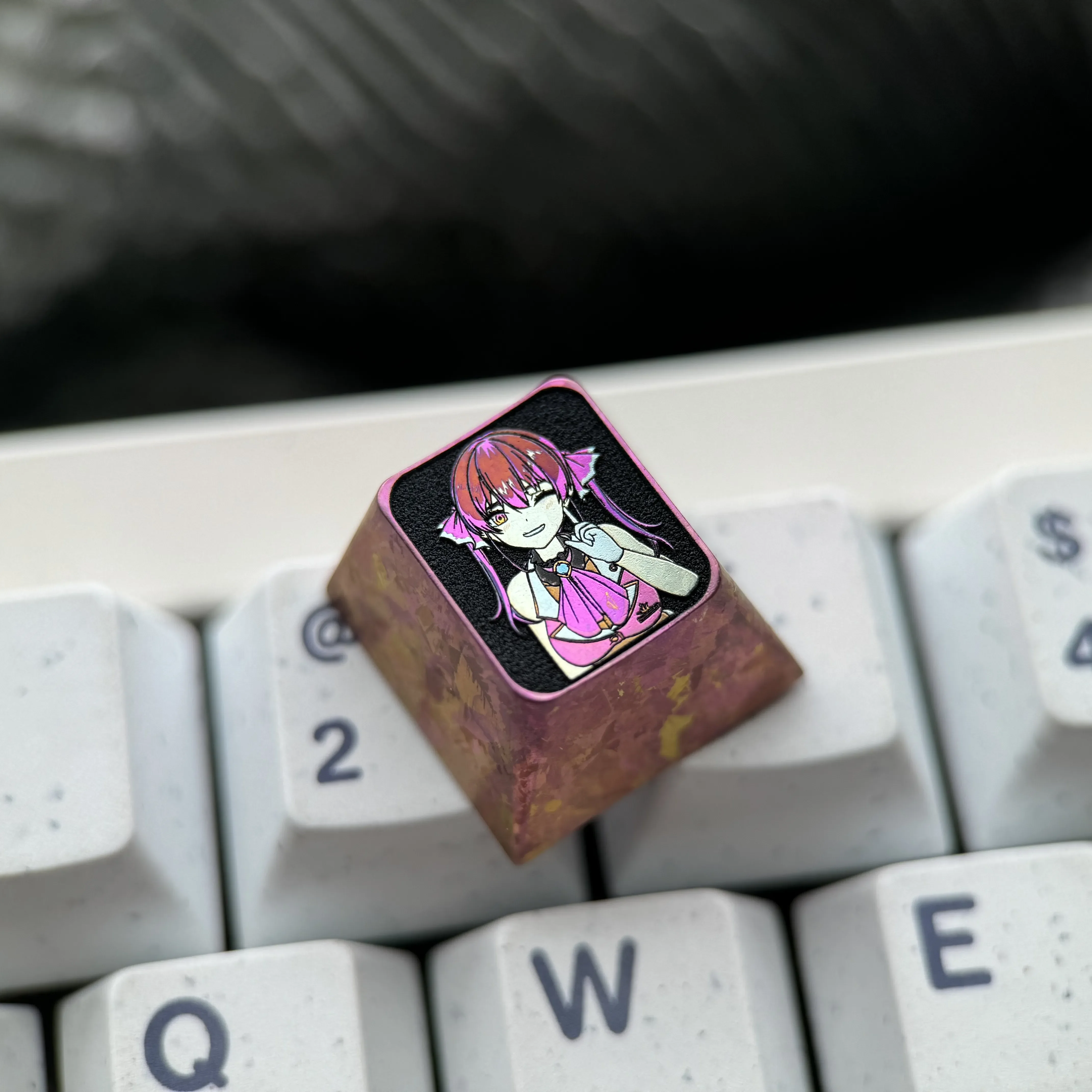 Close-up of a premium titanium Houshou Marine ESC keycap, featuring intricate VTuber anime craftsmanship and vibrant detail.