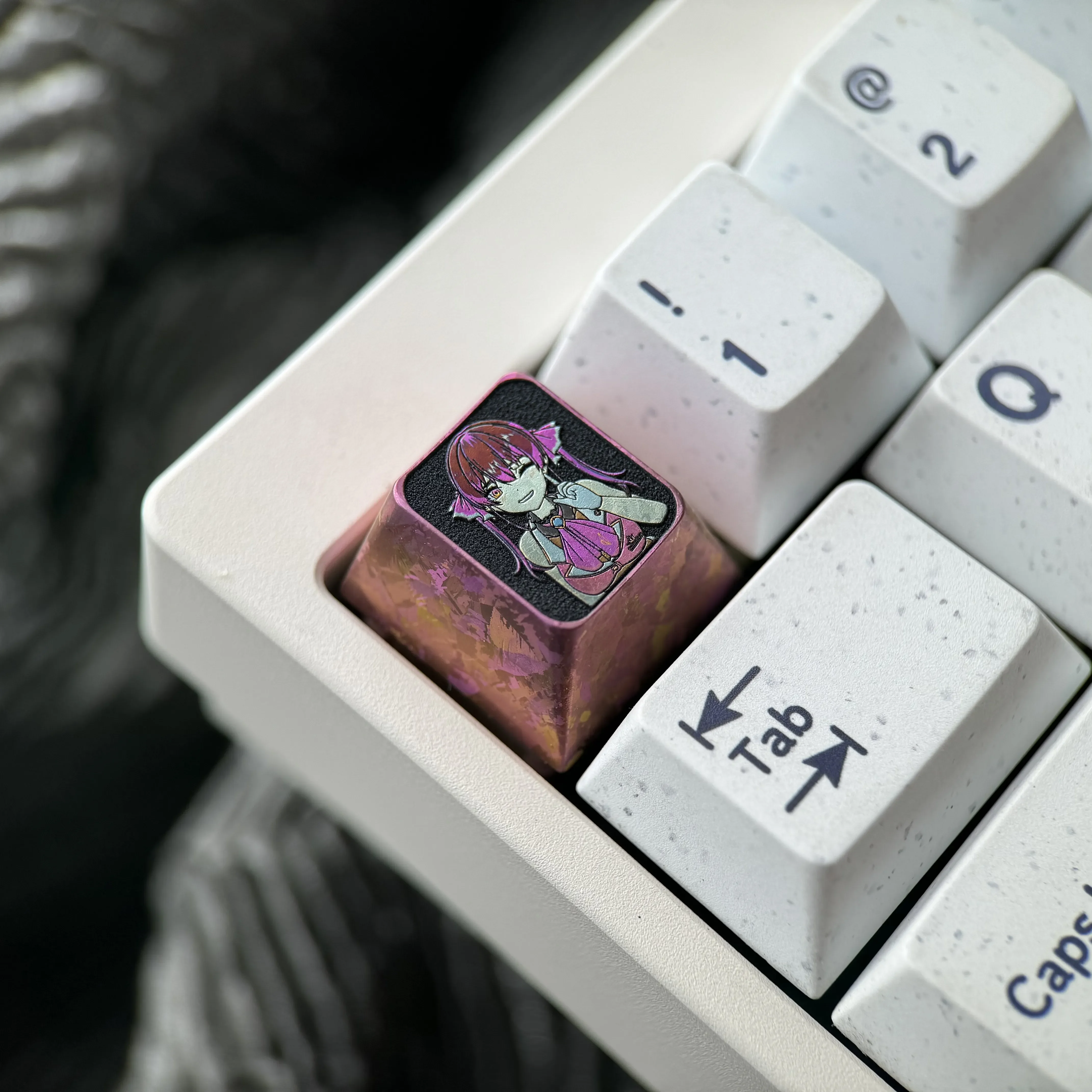 Artistic Houshou Marine titanium ESC keycap from a new angle, highlighting its vibrant anime character tribute and premium metallic craftsmanship.
