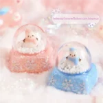 Magical Interactive Snowman Keycaps, featuring a miniature crystal ball winter scene. Press to activate the jumping blue snowman and sparkling design.