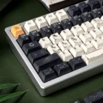 Discover the premium Interstellar keycaps set from various angles, highlighting the durable PBT dye-sublimated cosmic deep space artistry.