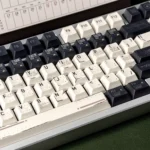 A product gallery view of the premium Interstellar keycaps set, highlighting the durable PBT dye-sub designs and cosmic deep space theme.