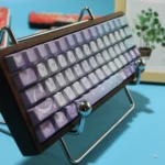 Close-up of the dreamy Iris Butterfly PBT backlit keycap set, showcasing delicate purple irises and ethereal butterflies with serene traditional motifs.