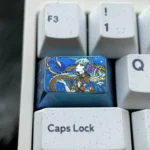 Close-up of a vibrant Jinhsi anime titanium keycap featuring premium titanium alloy and detailed, stylized anime art with a colorful, durable finish.