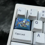 A collection of vibrant Jinhsi anime titanium keycap images, displaying its premium alloy construction and intricate artistic details from various angles.