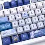 Artisan Kaeya Genshin Impact keycap set from various angles, showcasing icy blues, noble gold, and dark accents. An exclusive, elegantly themed design.