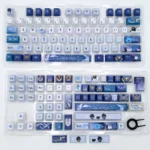 Exclusive artisan Kaeya Genshin Impact keycap set in icy blues, noble gold, and dark accents, elegantly displayed from various angles.