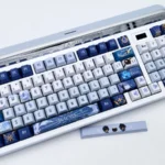 Showcasing exclusive Kaeya Keycaps set, an artisan Genshin Impact set with icy blues, noble gold, and dark accents capturing mystique.