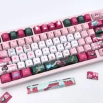 Premium Kiriko Keycaps Set for Overwatch, featuring vibrant red and white PBT and a playful Kitsune ninja design. Durable Cherry set.