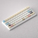 Vibrant Kitagawa Marin PBT keycap set displayed on a mechanical keyboard, showcasing exclusive anime art and custom design for enthusiasts.