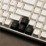 Playful Lightning Cloud Movement Control Keycaps from a dynamic angle, showcasing the translucent ABS material and vibrant RGB glow on the WASD/arrow set.