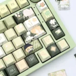 Multiple views of the elegant Lu Chen collectible keycap set, showcasing its minimalist design and exclusive side-engraved character details.