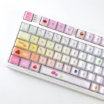 Playful gallery showcasing luminous macaron crystal jelly gradient keycaps set, highlighting their sparkling translucent finish from various angles.
