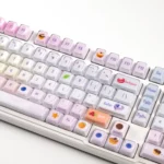 A gallery of Luminous Macaron Crystal Jelly Gradient Keycaps Set for mechanical keyboards, showing whimsical pastel colors and sparkling translucent design.