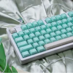 An exquisite gallery showcasing Ethereal Shimmering Translucent Magnetic Keycaps Set from various angles, highlighting their unique jade elegance.