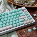 A gallery showcasing ethereal shimmering translucent magnetic keycaps set, highlighting their jade-like glow and premium PBT+PC finish from various design.