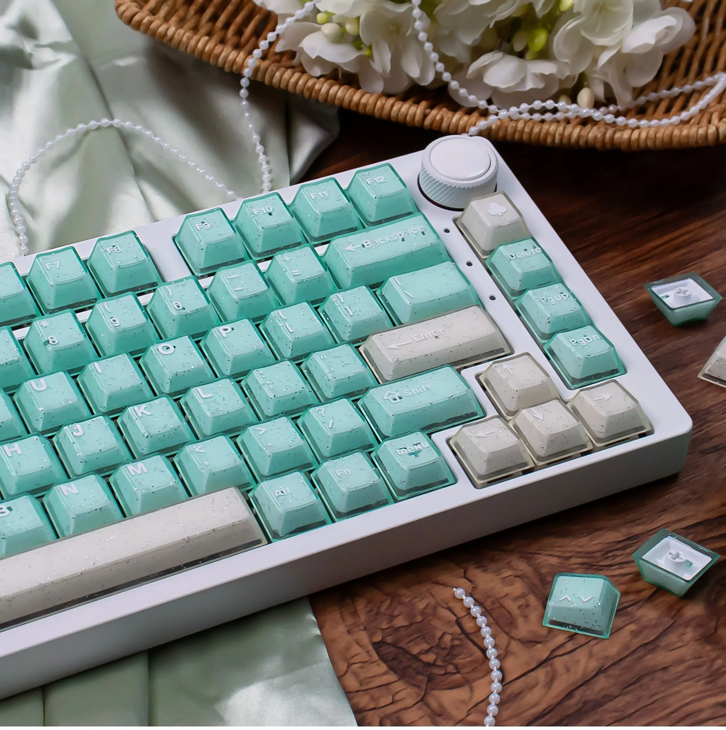 A gallery showcasing ethereal shimmering translucent magnetic keycaps set, highlighting their jade-like glow and premium PBT+PC finish from various design.