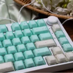 A complete set of ethereal translucent magnetic keycaps set, shimmering like jade from diverse angles, accentuating their unique crystal aesthetics.