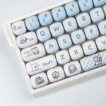 Playful Maltese Dog MOG Keycap Set, showcased from various angles. Emphasizes whimsical minimalist line art, clean modern design, and magnetic keyboard。