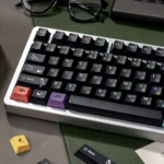 Sophisticated black PBT dye-sublimated magnetic switch keycaps set, custom fit and featuring elegant afternoon tea motifs, displayed in a premium view.