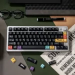 Sophisticated black PBT dye-sublimated magnetic switch keycaps set, custom fit, elegantly displayed with classic tea-inspired icons for a premium setup.