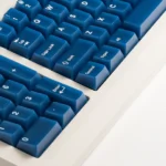 Explore the Deep Blue Frosted PC Magnetic Switch Keycaps Set, showcasing its cool, translucent Cherry profile from various angles.