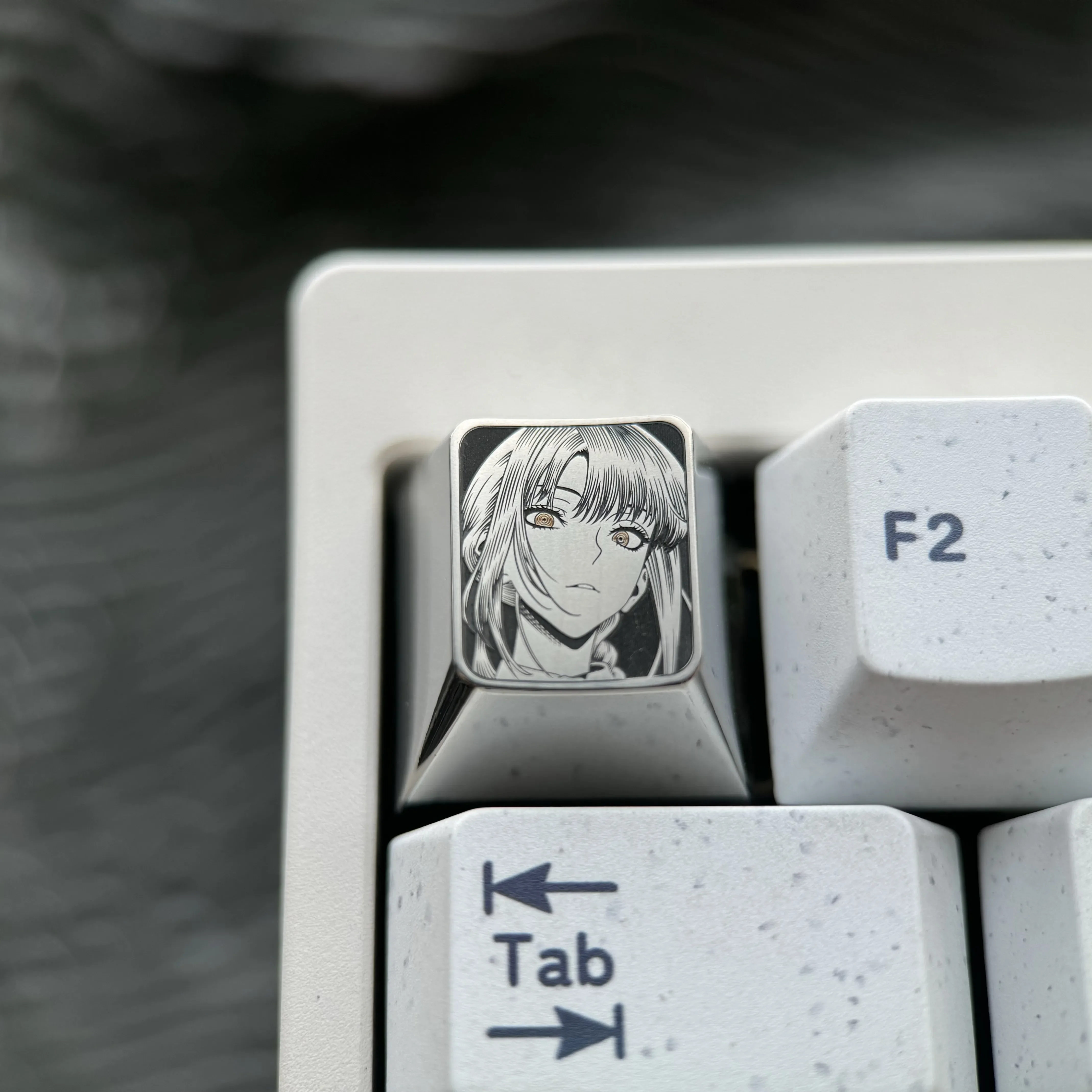 Makima Titanium Keycap: Precision-engraved artisan ESC key featuring intricate pointillism of Makima on sleek silver titanium. A premium collectible.