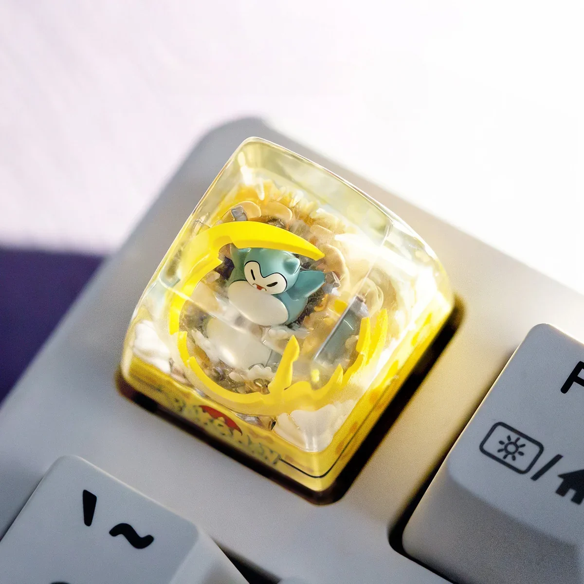 Playful luminous Pokemon: Meowth & Snorlax Transparent Keycaps, handcrafted from glossy translucent resin with SA profile, captured from an appealing new angle.