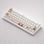 Gallery of Monogatari Keycaps set featuring Nadeko Sengoku, showcasing the exclusive PBT dye-sub artistry and durable texture from various angles.