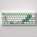 Whimsical Genshin Impact Nahida PBT dye-sub keycaps set showcased from multiple angles, featuring elegant green and white designs with intricate design.