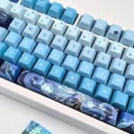 Detailed close-up of exclusive Neuvillette Hydro PBT dye-sub keycaps set, showcasing elegant Genshin Impact character art in rich blues and whites.